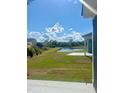 Beautiful backyard with lush green grass and a serene pond view, perfect for relaxation at 1237 Lady Bird Way, North Myrtle Beach, SC 29582