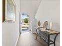 Inviting entryway featuring hardwood floors and stylish decor at 148 S Reindeer Rd., Surfside Beach, SC 29575