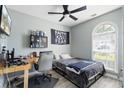 Bedroom featuring a ceiling fan, a large window, and a workstation area at 155 Westhaven Dr. # 14D, Myrtle Beach, SC 29579