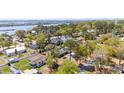 An aerial view of a residential community with beautiful landscaping and large trees at 218 Azalea Circle, Sunset Beach, NC 28468