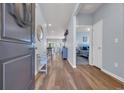 Inviting foyer with wood floors leading to an open-concept living space and a view of the main bedroom at 2771 Eclipse Dr., Myrtle Beach, SC 29577
