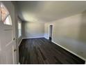 An empty living room featuring luxury vinyl plank floors and a fresh coat of neutral paint at 333 Whites Creek Rd., Georgetown, SC 29440