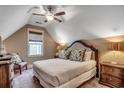 Bedroom features a patterned headboard, window, carpeted floor, and ceiling fan at 4964 Salt Creek Ct., North Myrtle Beach, SC 29582