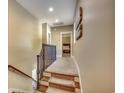 Upstairs hallway featuring carpeted stairs and floors with an open doorway to a bedroom at 4964 Salt Creek Ct., North Myrtle Beach, SC 29582