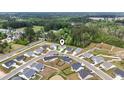 Aerial view of a serene community featuring well-maintained homes and lush greenery at 742 Woodside Dr., Conway, SC 29526