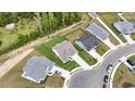 An aerial shot shows neighborhood homes with well-kept yards and neatly paved driveways on a sunny day at 742 Woodside Dr., Conway, SC 29526