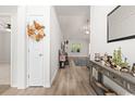 Bright entryway featuring hardwood floors, neutral walls, and an elegant console table at 742 Woodside Dr., Conway, SC 29526