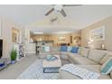 Relaxing living space with an open concept to the kitchen and dining, featuring cozy decor and natural light at 10 Logan Berry Ct. # H, Murrells Inlet, SC 29576