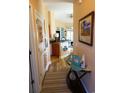Inviting hallway with coastal decor leads into the kitchen and living areas, showcasing the home's charm at 110 Portsmith Dr. # 8, Myrtle Beach, SC 29588