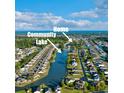 Aerial view of the home in a community with a lake at 147 Marsh Deer Place, Surfside Beach, SC 29575