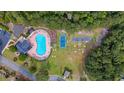 Aerial view of community amenities including a large pool, basketball court, and recreation areas at 293 Hillsborough Dr., Conway, SC 29526