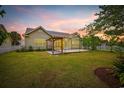 A spacious backyard with a wooden deck, pergola, and lush green grass perfect for outdoor living at 293 Hillsborough Dr., Conway, SC 29526