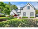 Charming home with well-manicured lawn, white siding, and beautiful landscaping at 3300 Prioloe Dr., Myrtle Beach, SC 29588