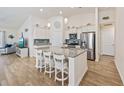 Spacious kitchen with an island, stainless steel appliances, granite countertops, and breakfast bar at 351 Logan St., Little River, SC 29566