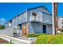 Exterior shot of two-story condo featuring a balcony and well-maintained landscaping at 4504 S Ocean Blvd. # A, North Myrtle Beach, SC 29582