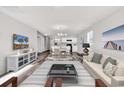 Open-concept living space showcasing modern decor, sleek flooring, and abundant natural light throughout at 500 Dundalk Dr., Conway, SC 29526