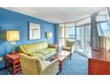 Relaxing living room featuring comfortable seating and a view of the ocean and balcony at 5300 N Ocean Blvd. # 922, Myrtle Beach, SC 29572