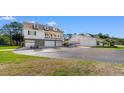 Charming two-story home with a spacious driveway and boat parking, with a separate garage for added storage at 1030 Fork Retch Ct., Mullins, SC 29574