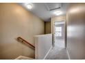 Upstairs hallway with carpet and access to multiple rooms, illuminated by a ceiling light at 104 Barnacle Ln. # 3, Little River, SC 29566