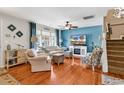 Cozy living room with a large window, plush seating, and a decorative fireplace at 1046 Palisade Circle # 1046, Myrtle Beach, SC 29577