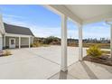 View from covered porch of large driveway and home's exterior at 135 Stonewall Circle # 7-2, Longs, SC 29568