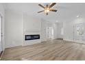 Bright living room has wood floors, neutral walls, and recessed lighting at 135 Stonewall Circle # 7-2, Longs, SC 29568