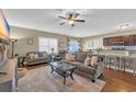 Open concept living room flowing into dining and kitchen area; ample seating and natural light at 1512 Virginia Pine Dr., Longs, SC 29568