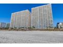 Expansive view of two condominium buildings and the beach at 1625 S Ocean Blvd. # 1604, North Myrtle Beach, SC 29582