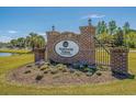 Decorative brick entrance sign for Waterway Palms Plantation surrounded by manicured landscaping at 168 West Palms Dr., Myrtle Beach, SC 29579