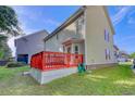 Red deck overlooking a large backyard at 190 Hamilton Way, Conway, SC 29526