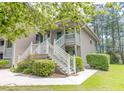 Beautiful condo with a welcoming front porch and well-maintained landscaping at 227 Pinehurst Ln. # 6D, Pawleys Island, SC 29585