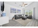 Bright living room featuring vaulted ceiling, modern decor, and a comfortable gray sectional sofa at 2409 Seabreeze Pl., Myrtle Beach, SC 29577