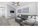 Bright living room featuring vaulted ceiling, modern decor, and a comfortable gray sectional sofa at 2409 Seabreeze Pl., Myrtle Beach, SC 29577