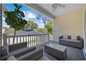 Inviting covered porch with comfortable seating, a ceiling fan, and a view of the surrounding neighborhood at 2602 Holly Dr., North Myrtle Beach, SC 29582