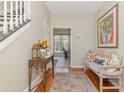 Inviting foyer with hardwood floors, bench, and decorative table, flowing into adjacent living spaces at 403 Brandymill Blvd, Myrtle Beach, SC 29588