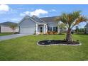 Charming single-Gathering home featuring a well-manicured lawn, attached garage, and beautiful curb appeal at 5039 Gladstone Dr, Conway, SC 29526