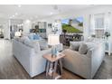 Bright, open-concept living room featuring hardwood floors and comfortable seating at 5039 Gladstone Dr, Conway, SC 29526