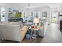 Cozy living room with hardwood floors, neutral colors, and lots of natural light at 5039 Gladstone Dr, Conway, SC 29526