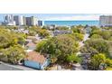 The aerial view shows a home nestled amongst mature trees, close to the beach and amenities at 504 A S 19Th Ave. S, North Myrtle Beach, SC 29582