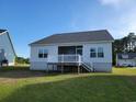 Spacious backyard featuring a deck, ideal for outdoor entertaining and relaxation at 512 Charlton Blvd., Georgetown, SC 29440