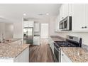Bright kitchen features stainless steel appliances, granite counters, and ample cabinet space at 512 Charlton Blvd., Georgetown, SC 29440