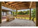 Large picnic bench under home with wood flooring and space to hang a hammock at 6001-1205 S Kings Hwy., Myrtle Beach, SC 29575