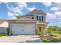 Beautifully landscaped two-story home with a spacious two-car garage and welcoming front entrance at 1313 Cascarilla Ct., Myrtle Beach, SC 29579