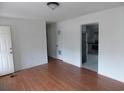Bright living room with hardwood floors and fresh paint, showcasing the home's move-in readiness at 1465 Dirty Branch Rd., Conway, SC 29527