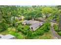 Aerial view of the property showing the metal roof and a view of the surrounding lush greenery at 1506 7Th Ave., Conway, SC 29526