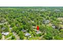 Overhead view showcasing the home nestled among lush trees in a quiet neighborhood at 1506 7Th Ave., Conway, SC 29526