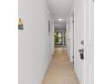 Bright hallway features tile flooring and leads to an open living space at 1851 Colony Dr. # 4-F, Surfside Beach, SC 29575
