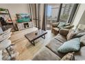 Comfortable living room with waterfront view, sliding glass doors and casual furnishings at 2310 N Ocean Blvd. # 308, Myrtle Beach, SC 29572