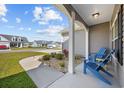 Inviting front porch with cozy seating and landscaped garden, perfect for relaxing at 237 Copperwood Loop, Conway, SC 29526