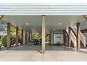 Spacious covered carport area with wooden support beams, providing ample space for parking and outdoor living at 4411 Grande Harbour Blvd., Little River, SC 29566